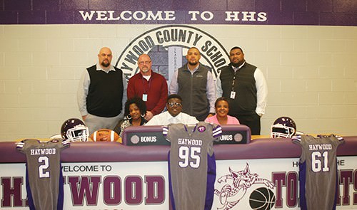 Pictured with Taycwon were his mother, Sharon Hammond Dancy, and his grandmother, Patricia Hammond. Also witnessing the signings were former HHS football Coach Ernie Jackson, HHS Principal Jerry Pyron, HHS Head Football Coach Steve Hookfin and HHS Assistant Principal and Athletic Director Tim Seymour.