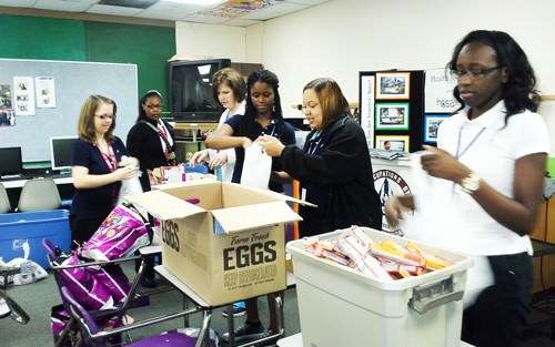 HOSA students help with the Backpack Food Program